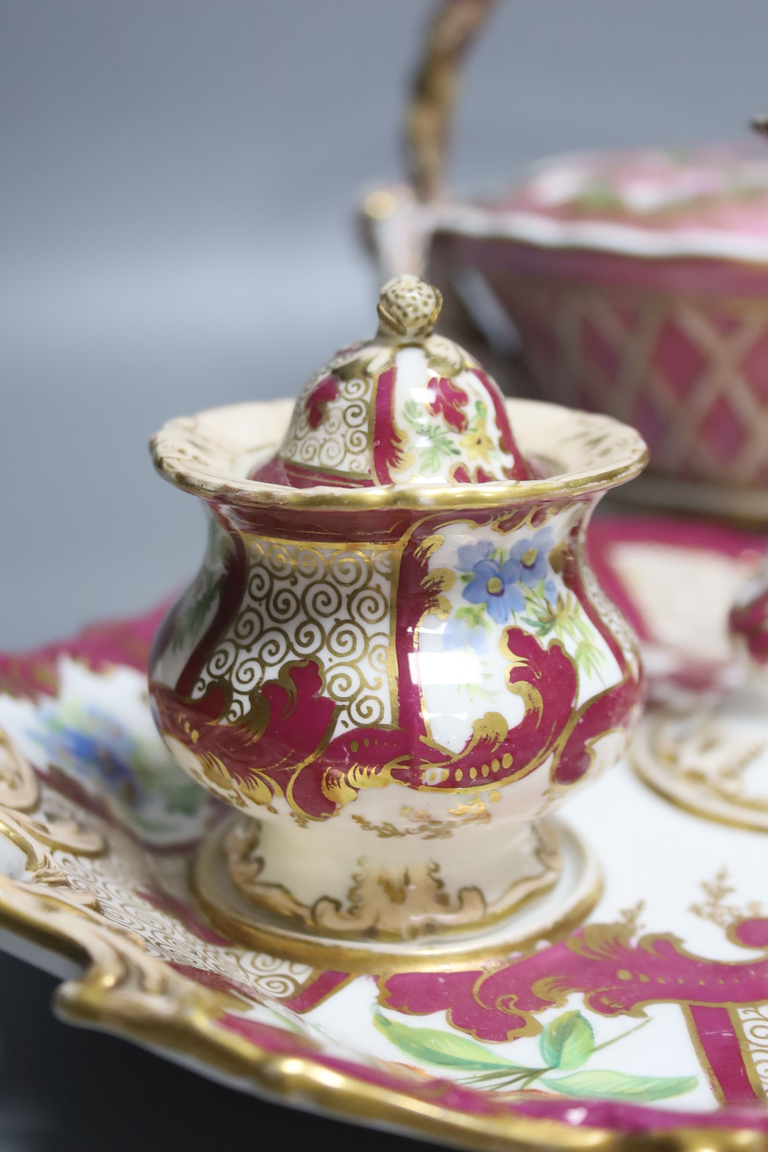 A 19th century English porcelain inkstand, a basket and associated cover and a Spode base, tallest 20cm